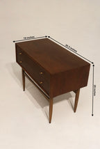 Close-up of drawer from vintage walnut and teak furniture