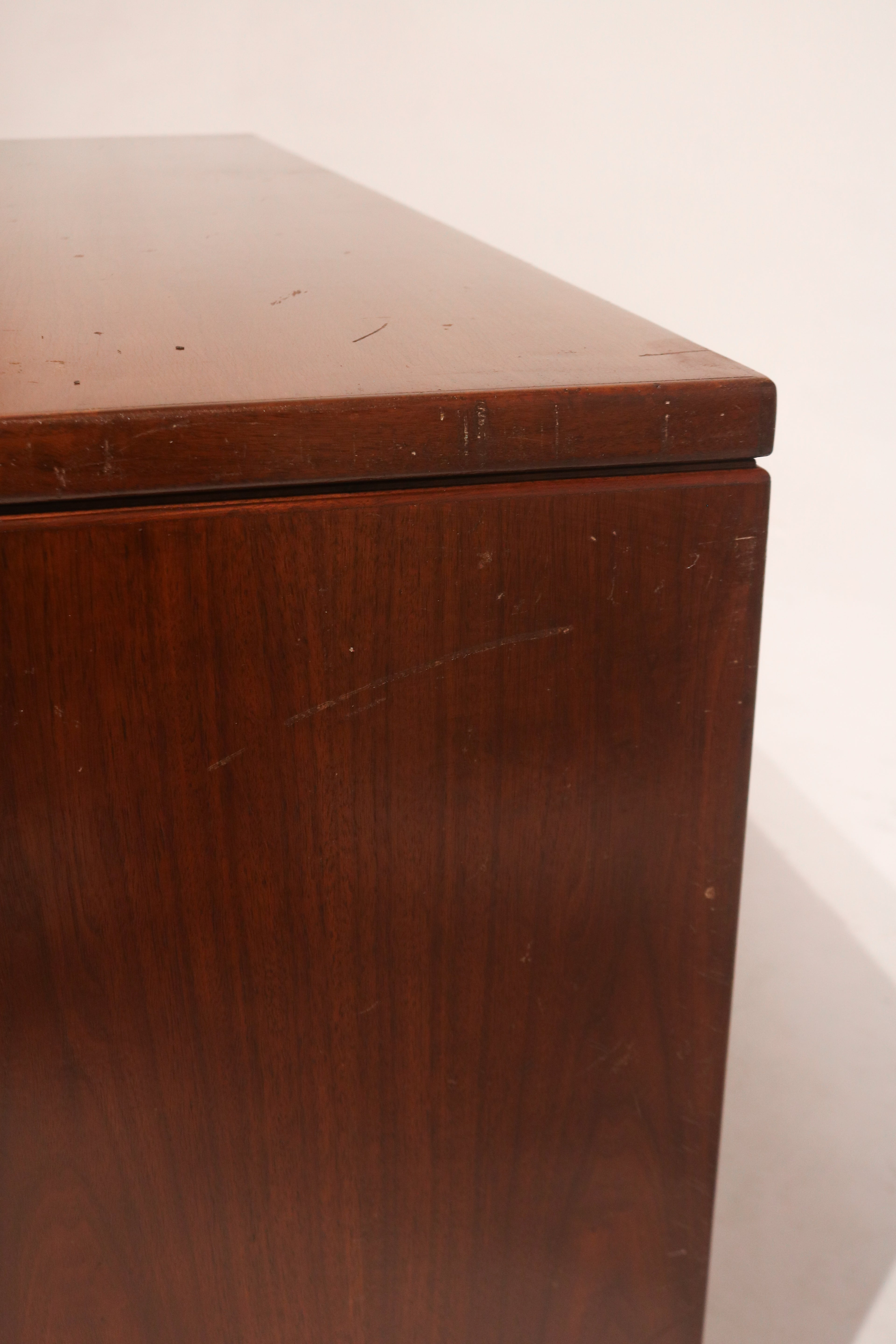 Close-up of right side showing structural detail and vintage patina in wooden sideboard