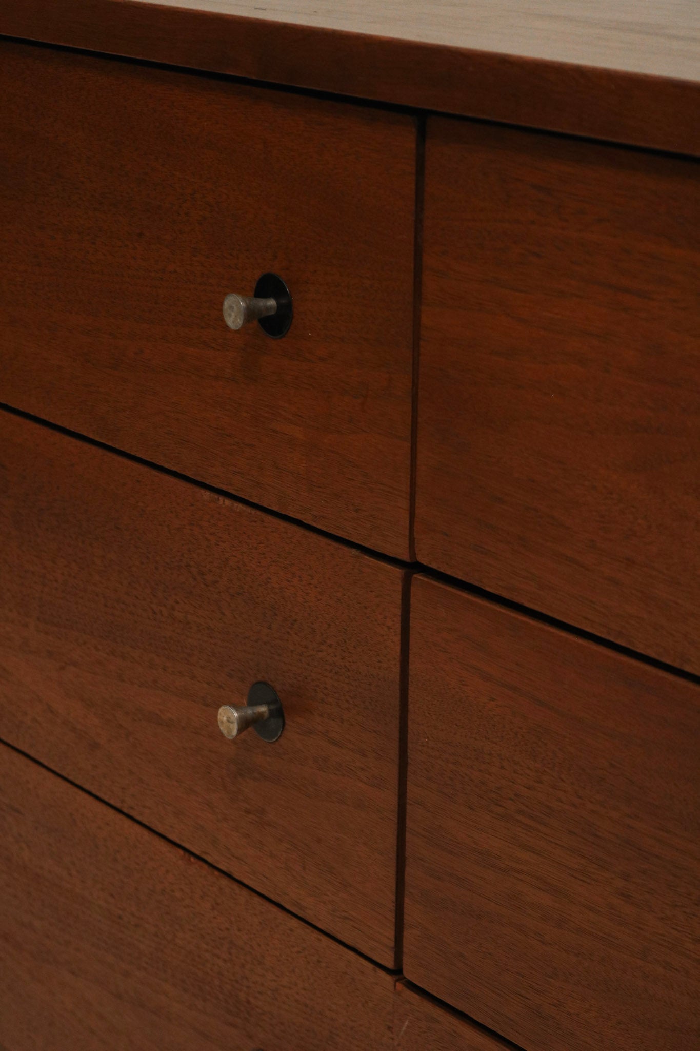 Angle view showcasing the mid-century modern style lines and rich walnut color