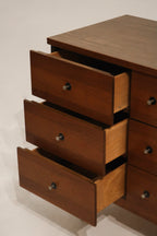 Bottom leg detail highlighting the gently tapered mid-century legs in walnut finish