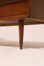 Closeup of wood grain texture on Mcm Vintage Lowboy Dresser; rich walnut veneer finish