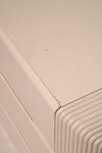 Top-down shot of dresser surface with clean lacquered wood grain