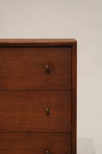 Corner view showing the smooth edges and warm walnut tone of the Mcm bedside table