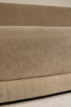 Photo of back frame and fabric wrap on Contemporary West Elm sofa, champagne velvet upholstery and visible support structure in clean condition