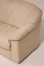 Full front-facing view of Italian leather Salotti Natuzzi sofa with seat cushions visible