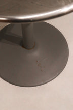 Perspective view highlighting tabletop thickness and compact circular design