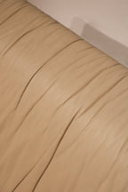 Zoomed-in texture detail of Italian leather material, rich grain and natural tone