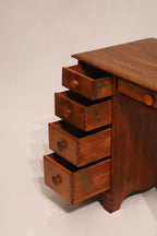 Side angle showing the desk’s solid maple wood frame and drawer alignment