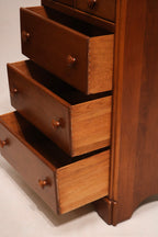 Highlight of drawer pull hardware fixed on maple wood front with vintage style
