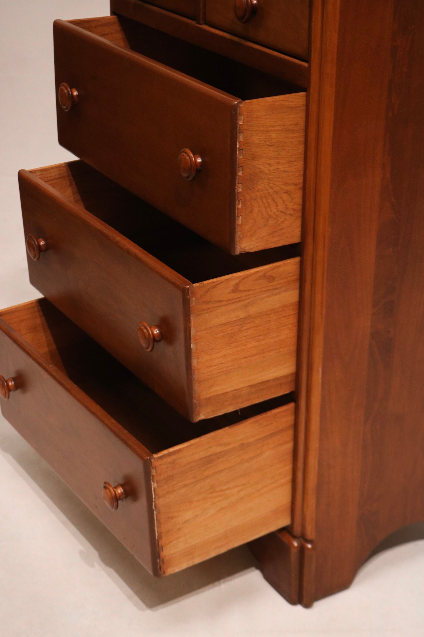 Highlight of drawer pull hardware fixed on maple wood front with vintage style