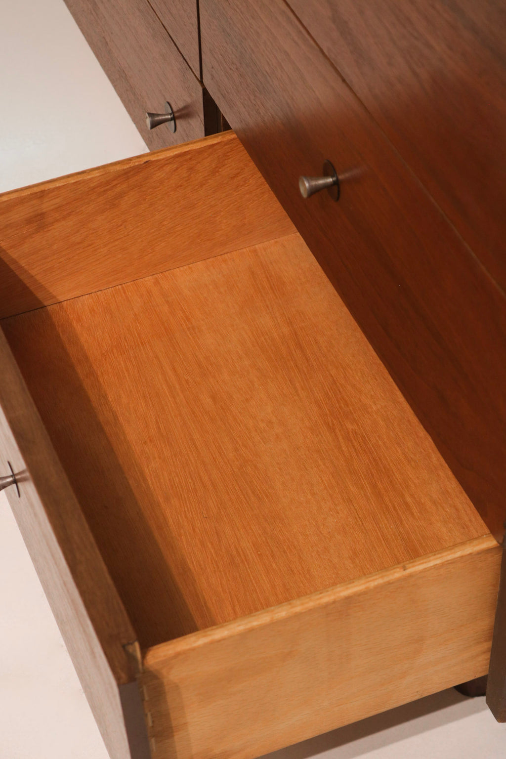 Close-up of rich walnut finish texture showcasing natural grain patterns and variation