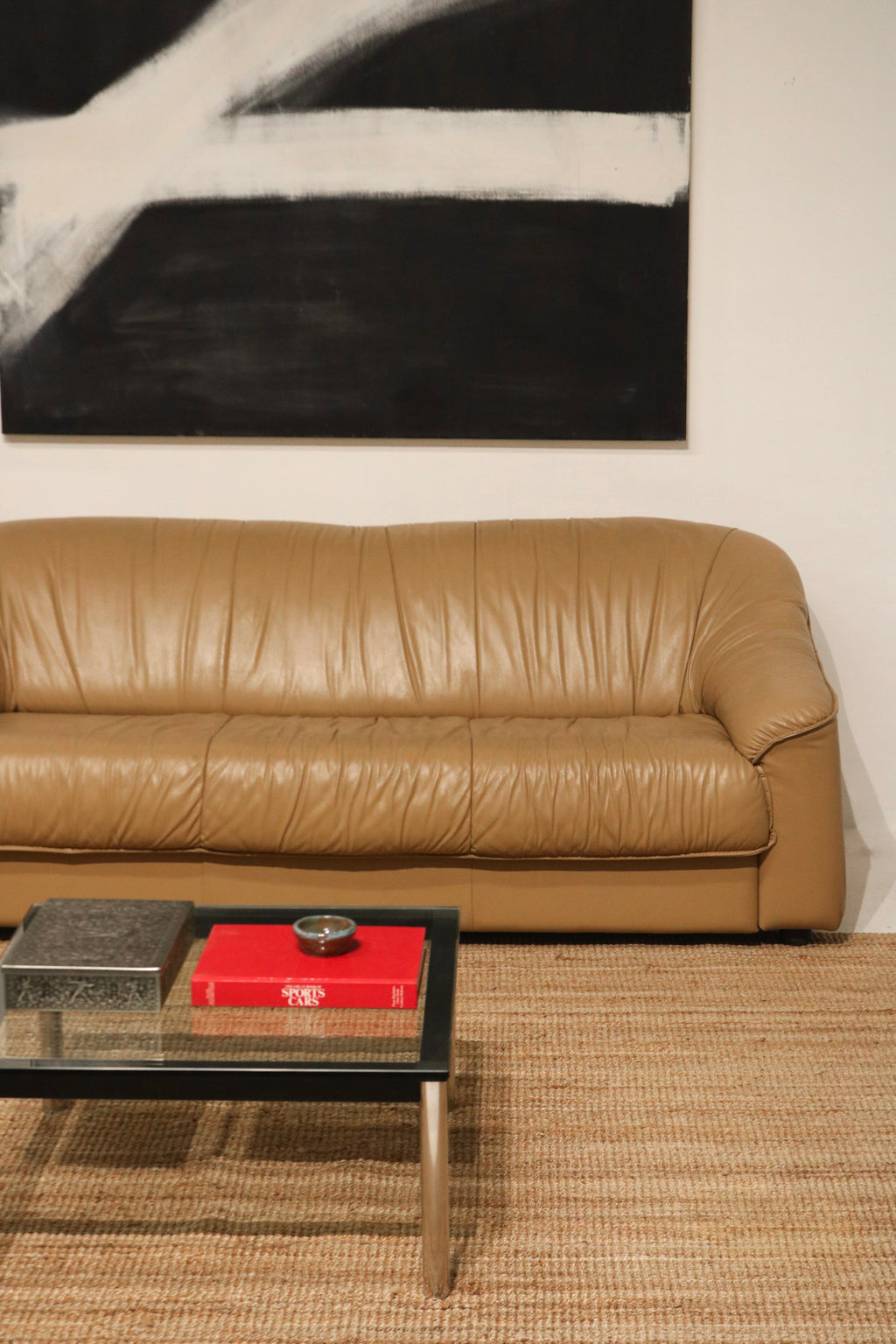 Close-up of leather texture on the Italian vintage sofa showing natural patina