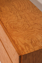 Detailed view of dresser’s side panel built in oak wood with visible aging marks