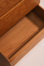 Bottom corners showing subtle chips and oak wood grain details