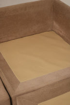 Photograph of cushion spring and interior support on fabric sofa with visible construction, foam fill appearance and vintage frame quality