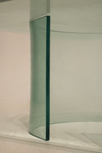 Corner view of the glass table showcasing vintage design lines and precise construction details
