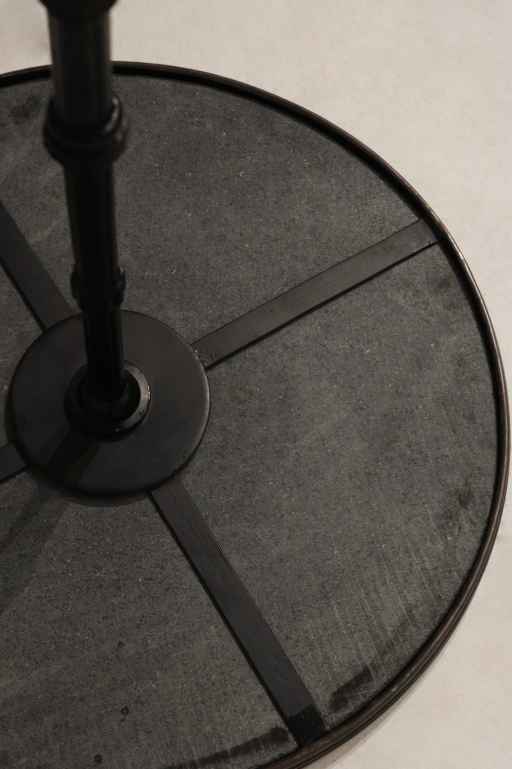 Close-up of round stone tabletop on the Vintage Bistro Table highlighting natural texture and smooth finish
