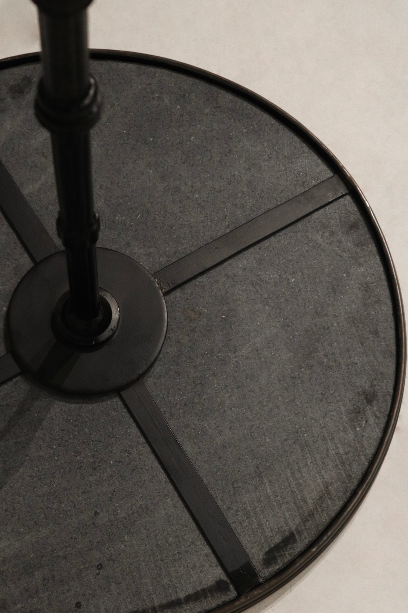Close-up of round stone tabletop on the Vintage Bistro Table highlighting natural texture and smooth finish