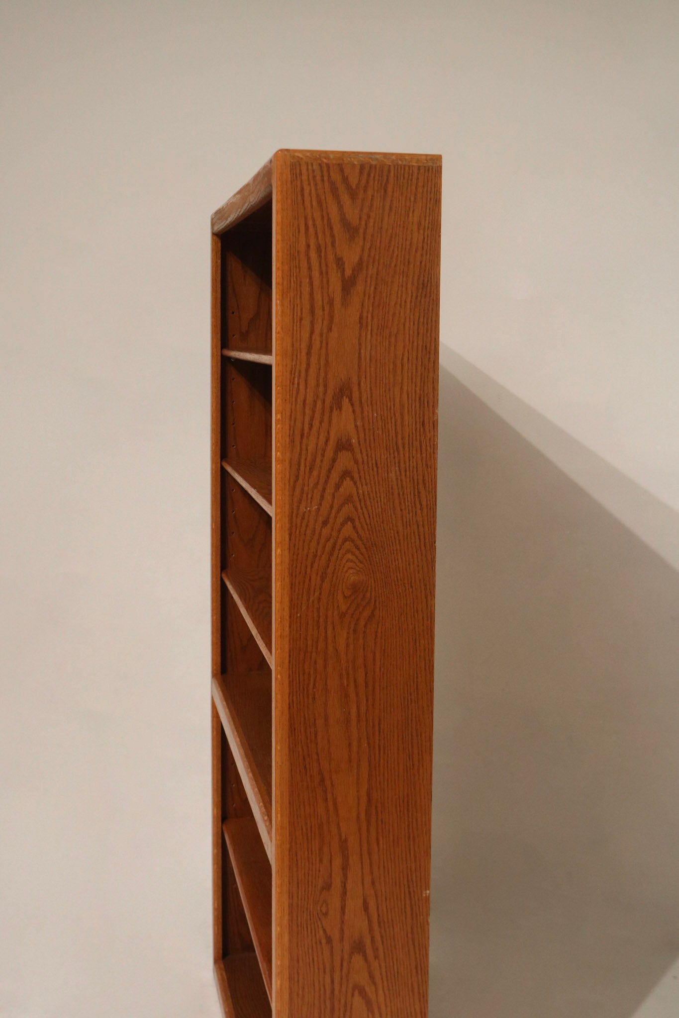 Close-up of solid wood grain and particleboard joinery on vintage cabinet