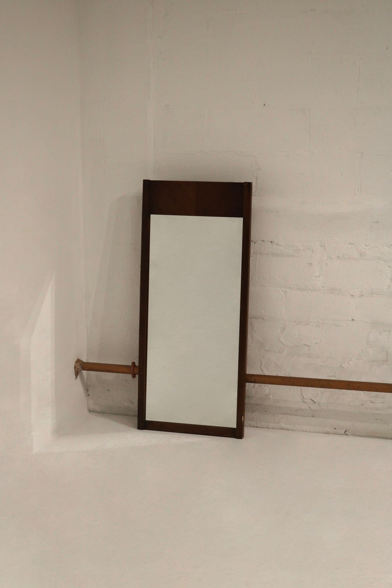 Full view of vintage MCM walnut wood frame rectangle mirror 45x20 with warm grain, clean glass, light surface scratches