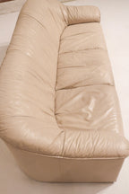 Texture detail highlighting the natural creases and softness of genuine beige leather
