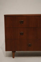 Close-up of small nick on drawer edge for condition reference