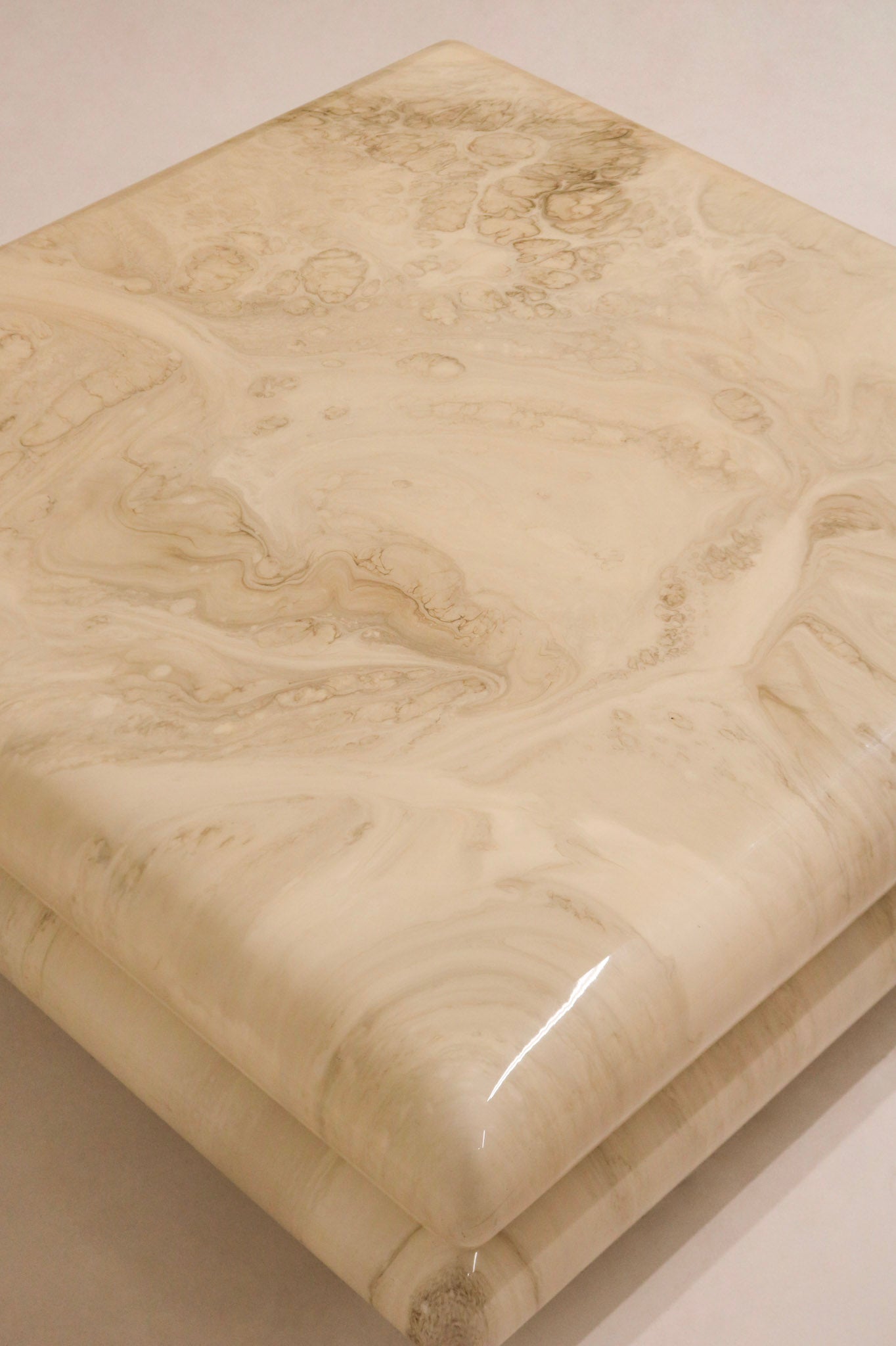 Side profile highlighting sleek resin edge and lacquered marbling design, typical of 1980s Italian style