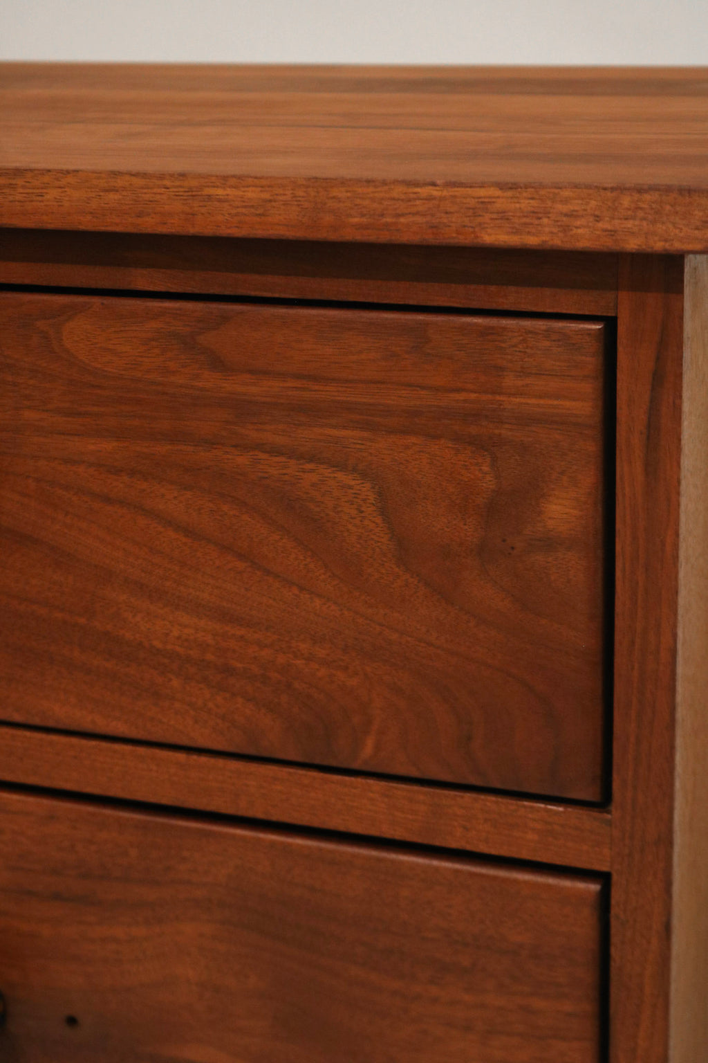 Angle view highlighting small hole on left cabinet door