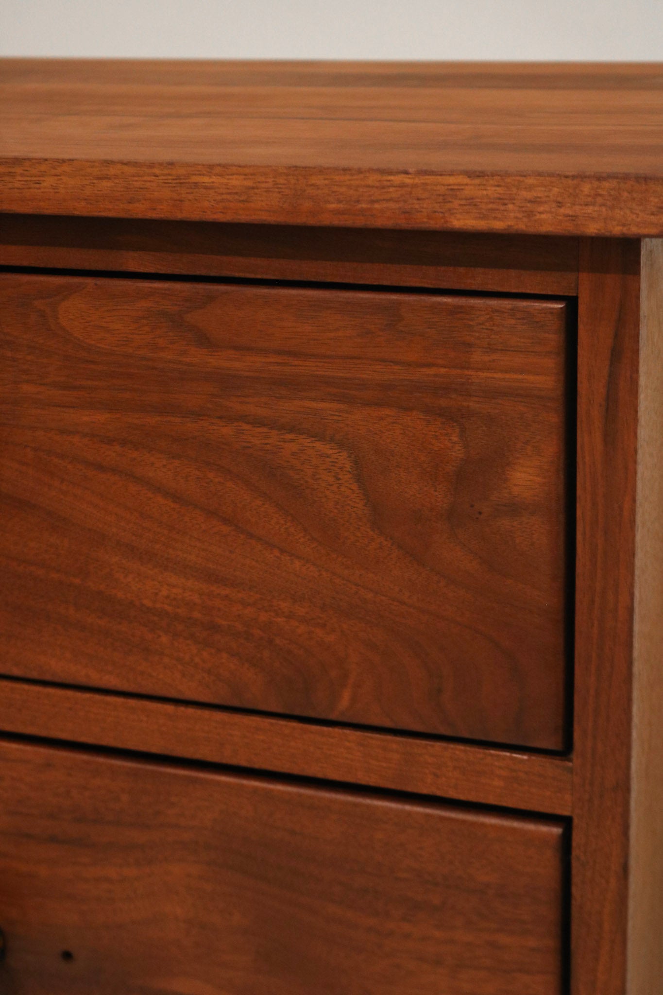 Angle view highlighting small hole on left cabinet door