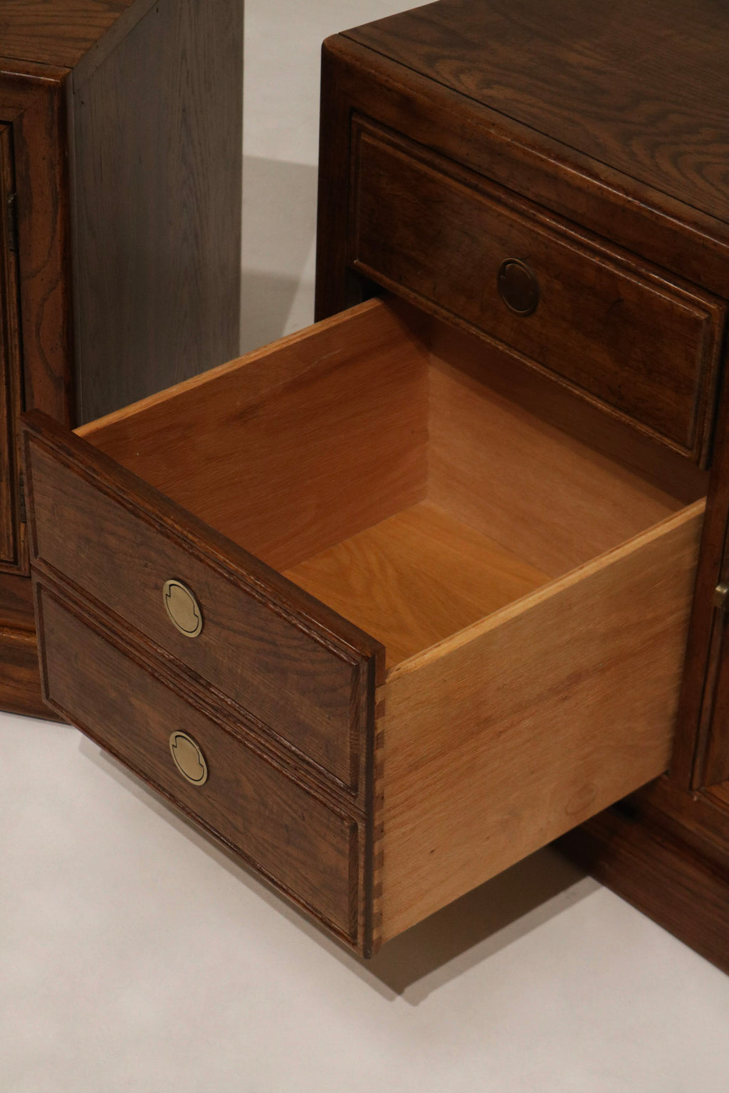 Texture shot of solid walnut grain under light showcasing depth, color variation and a smooth sealed wood surface on the nightstand top. Perfect for NYC apartments.