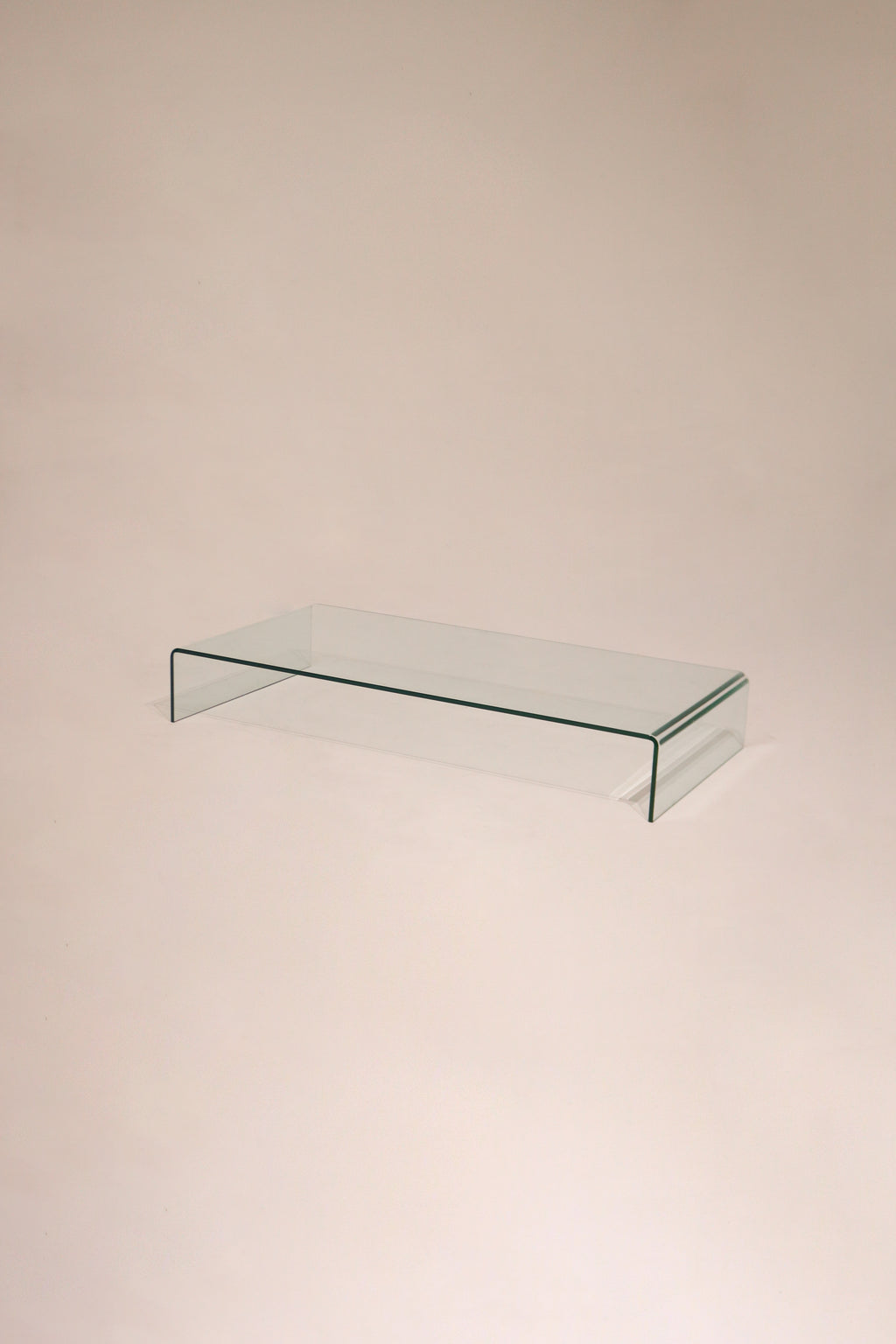 Main view of the Contemporary Modern solid glass waterfall coffee table, circa 1999, in pristine condition