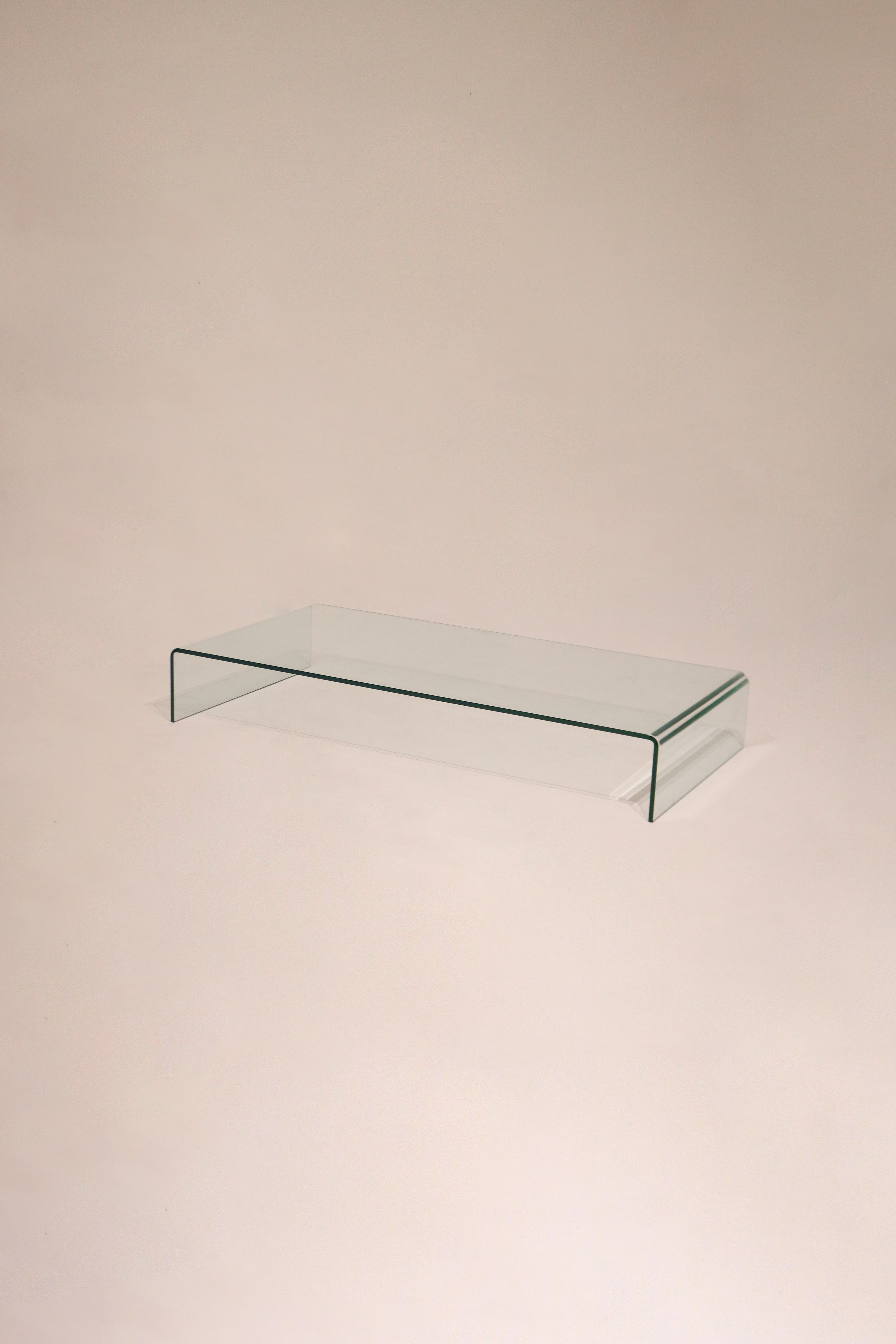 Main view of the Contemporary Modern solid glass waterfall coffee table, circa 1999, in pristine condition
