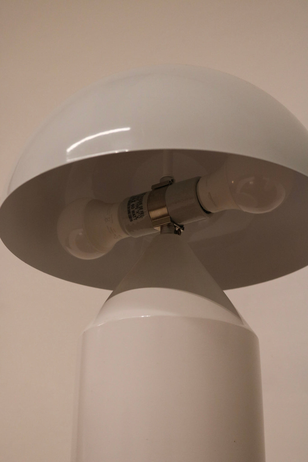 Close-up of lamp hardware showing the light socket and secure metal connections