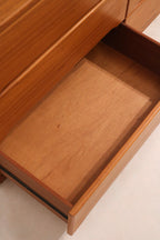 Natural light shot displaying rich tone of teak wood on MCM 9-drawer dresser