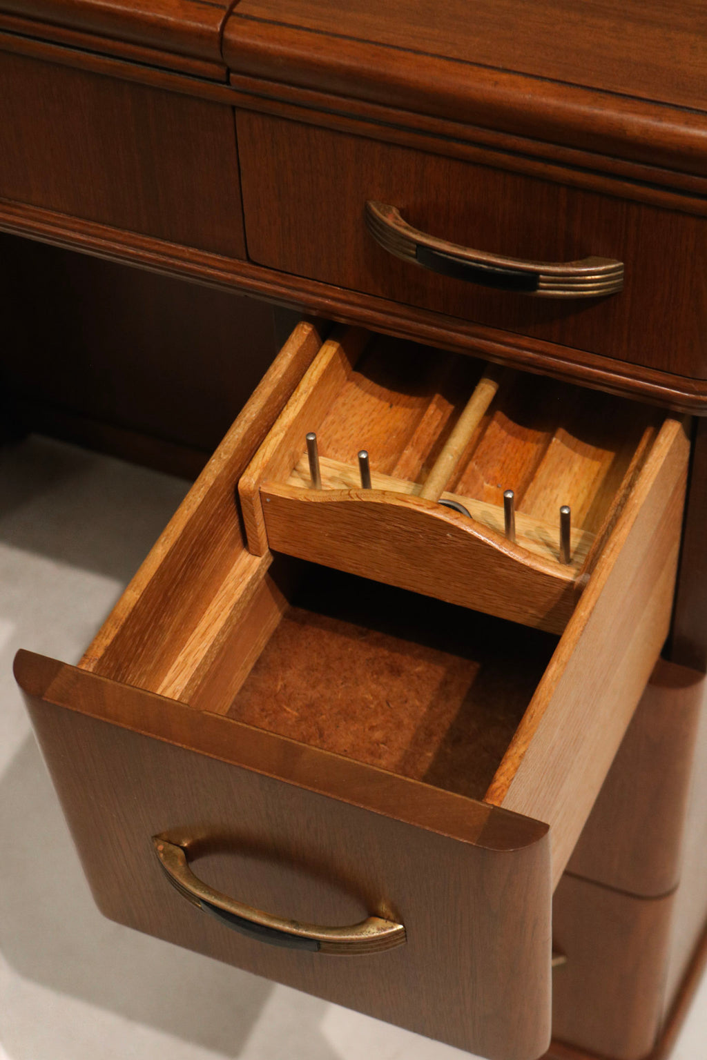 Screws and interior joinery close-up on walnut wood desk showing original fasteners and solid construction details