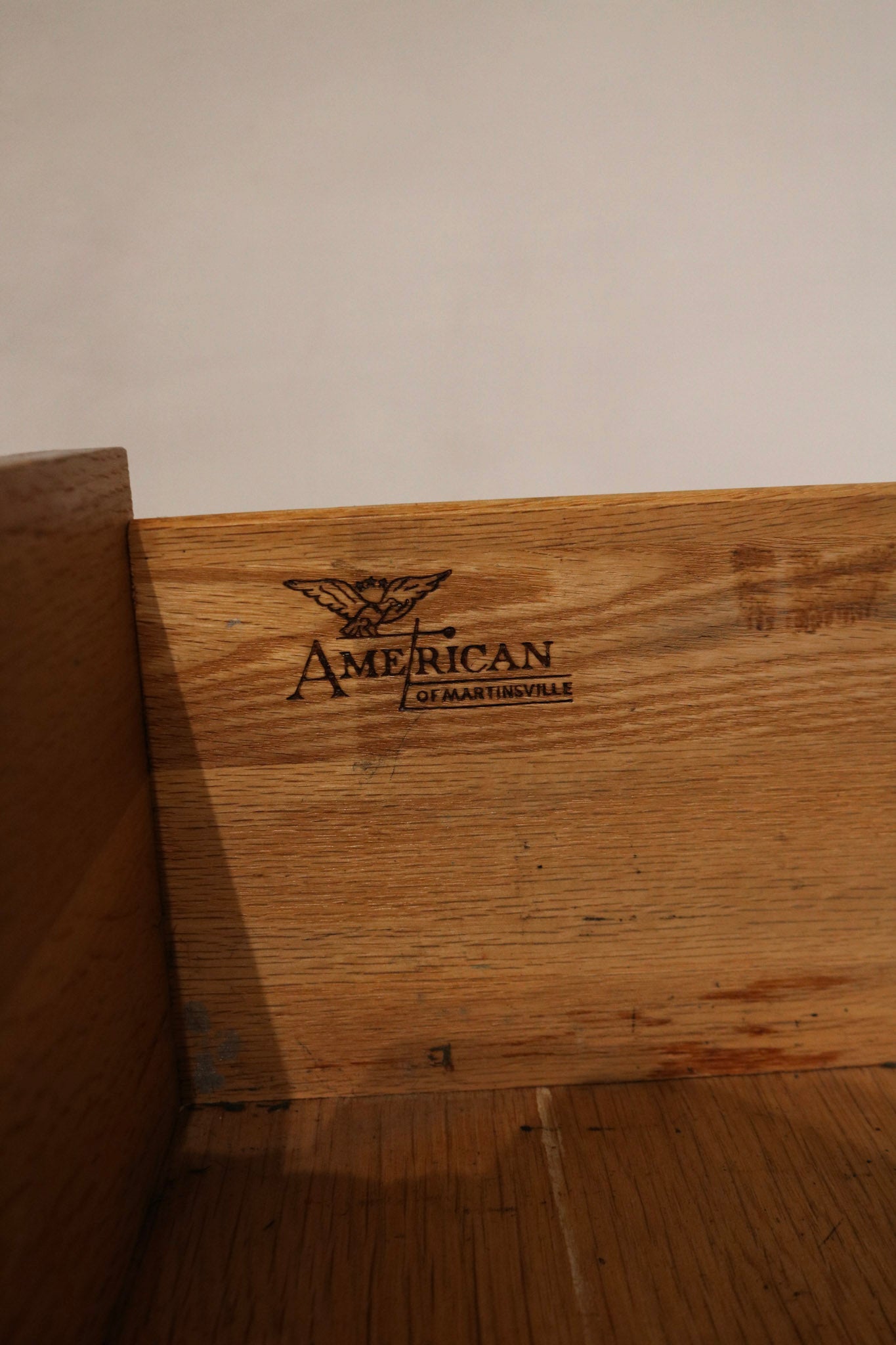 Side panel close-up showing consistent solid wood grain, edge joins and minor age-appropriate wear
