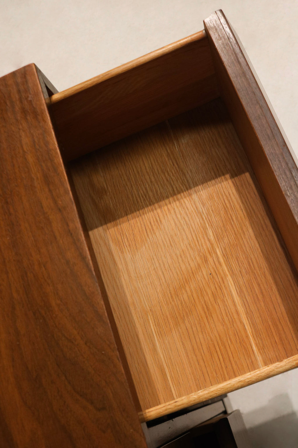 Textural close-up of walnut finish highlighting natural patterns, rich brown hues and subtle color variation