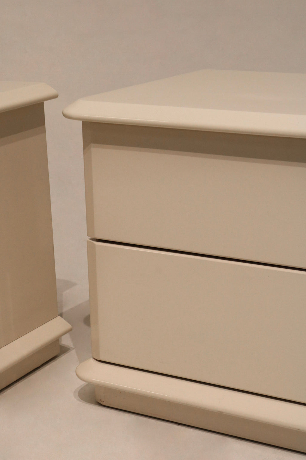 Angled view of nightstands showing dual units side-by-side and chrome hardware