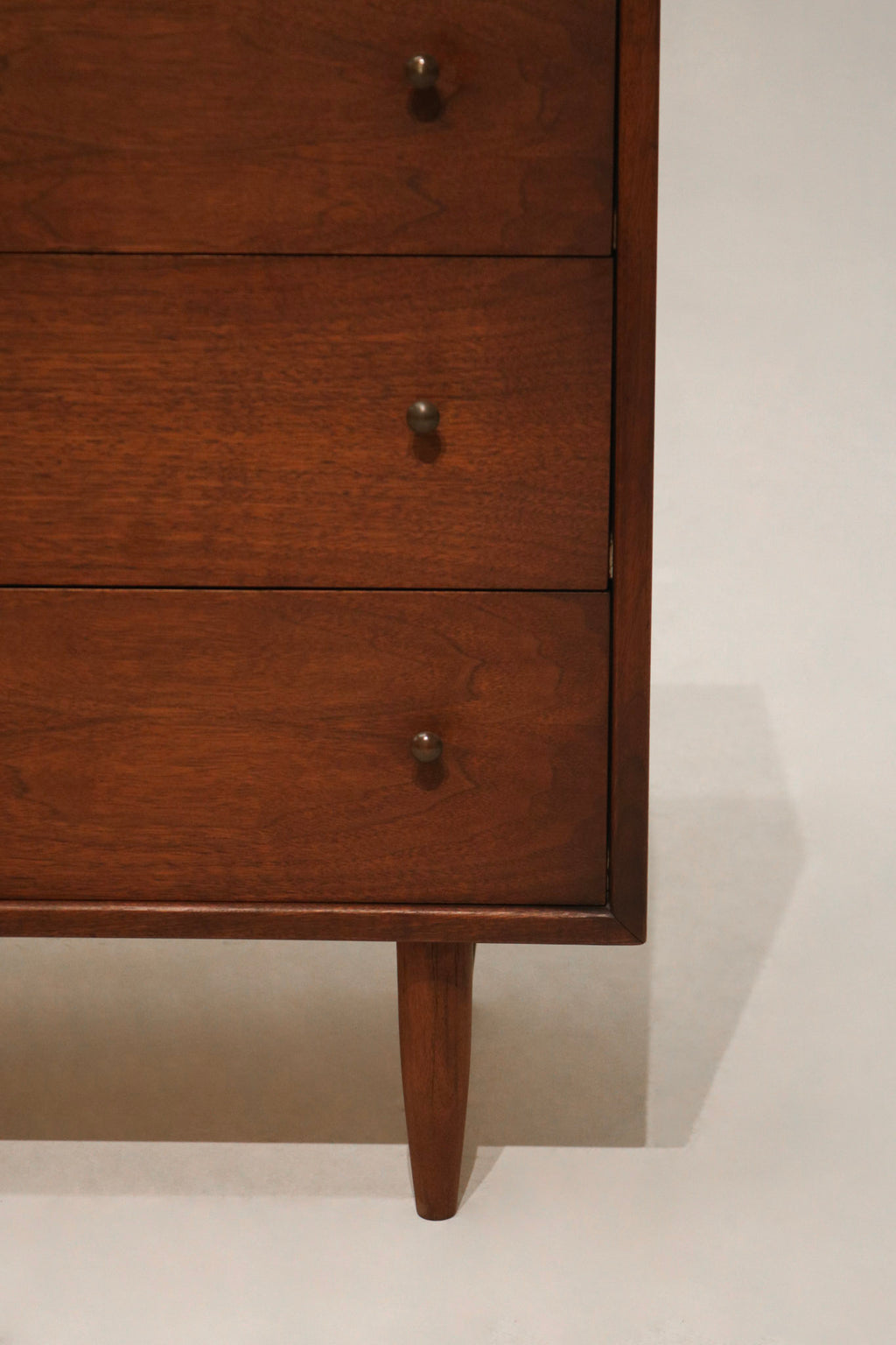 Interior of open drawer displaying clean inner space and precise wood joinery