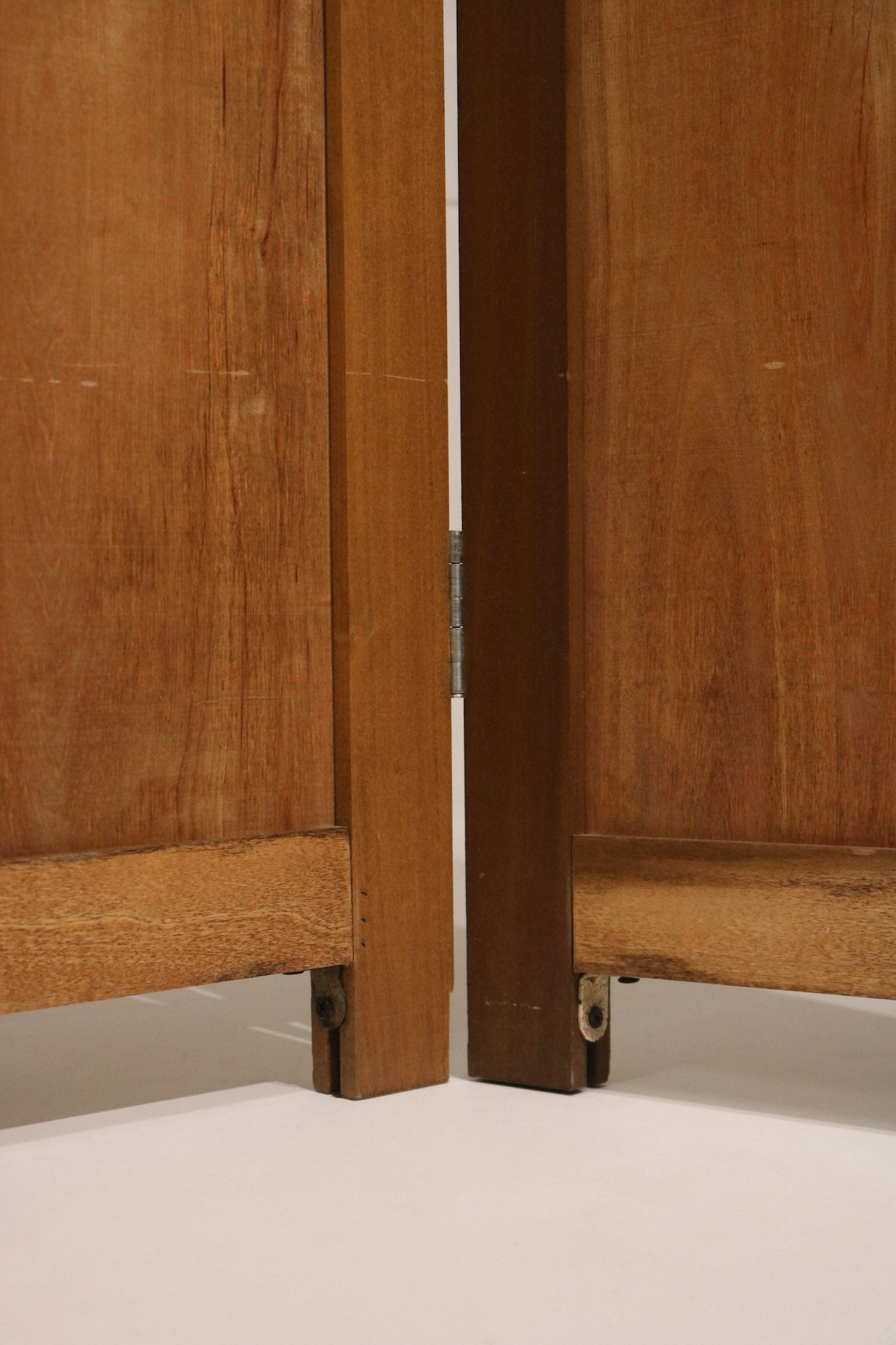 Rear view of vintage pine folding screen showing panel backs, secure hinges, consistent finish and sturdy construction.