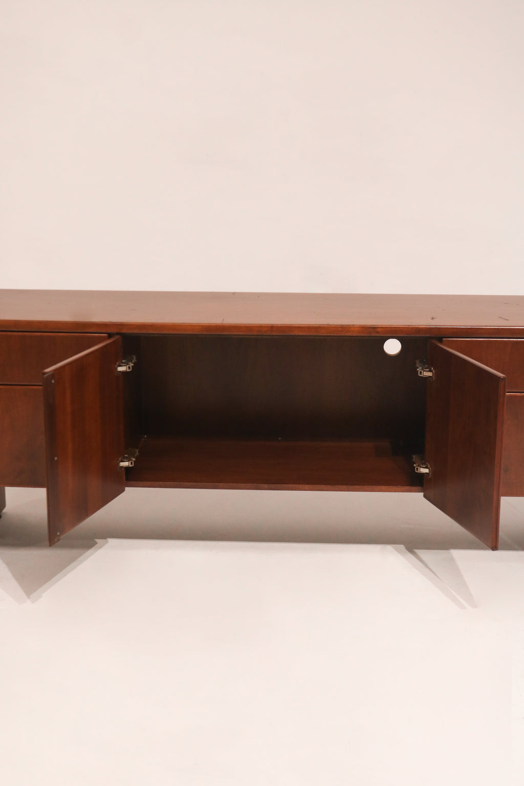 Interior of drawers displaying clean storage compartments in hardwood casing