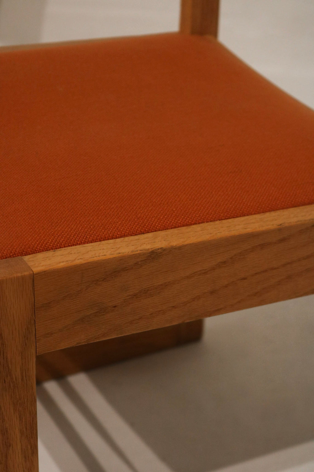 Wood finish detail highlighting light oak tone, grain patterns, small imperfections and preserved vintage finish on Jasper frames.