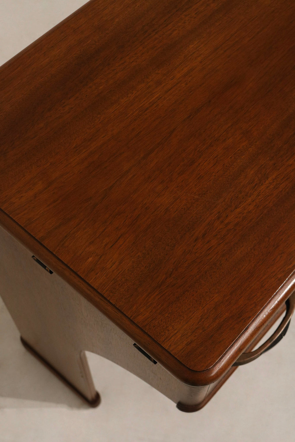 Detail: open drawers of walnut wood desk revealing interior wood finish, dovetail joints and smooth gliding hardware