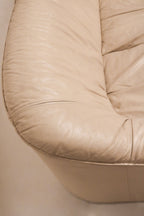 Rear angled shot of Italian leather sofa showing full back profile and architectural lines
