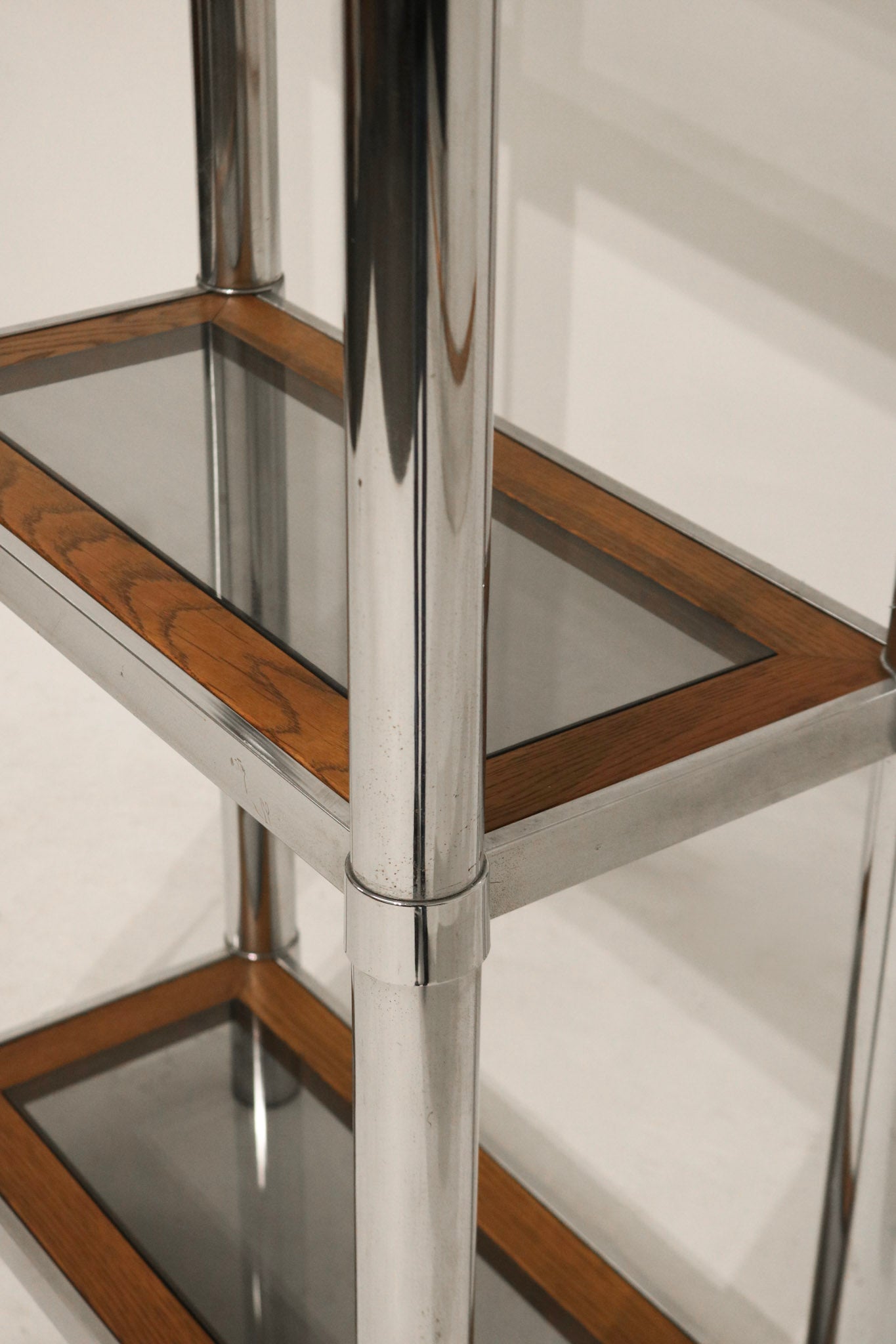 Detail of chrome surface with reflections and aging marks enhancing vintage look