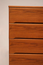 Open drawer showing smooth-glide wooden runners on Danish MCM chest of drawers