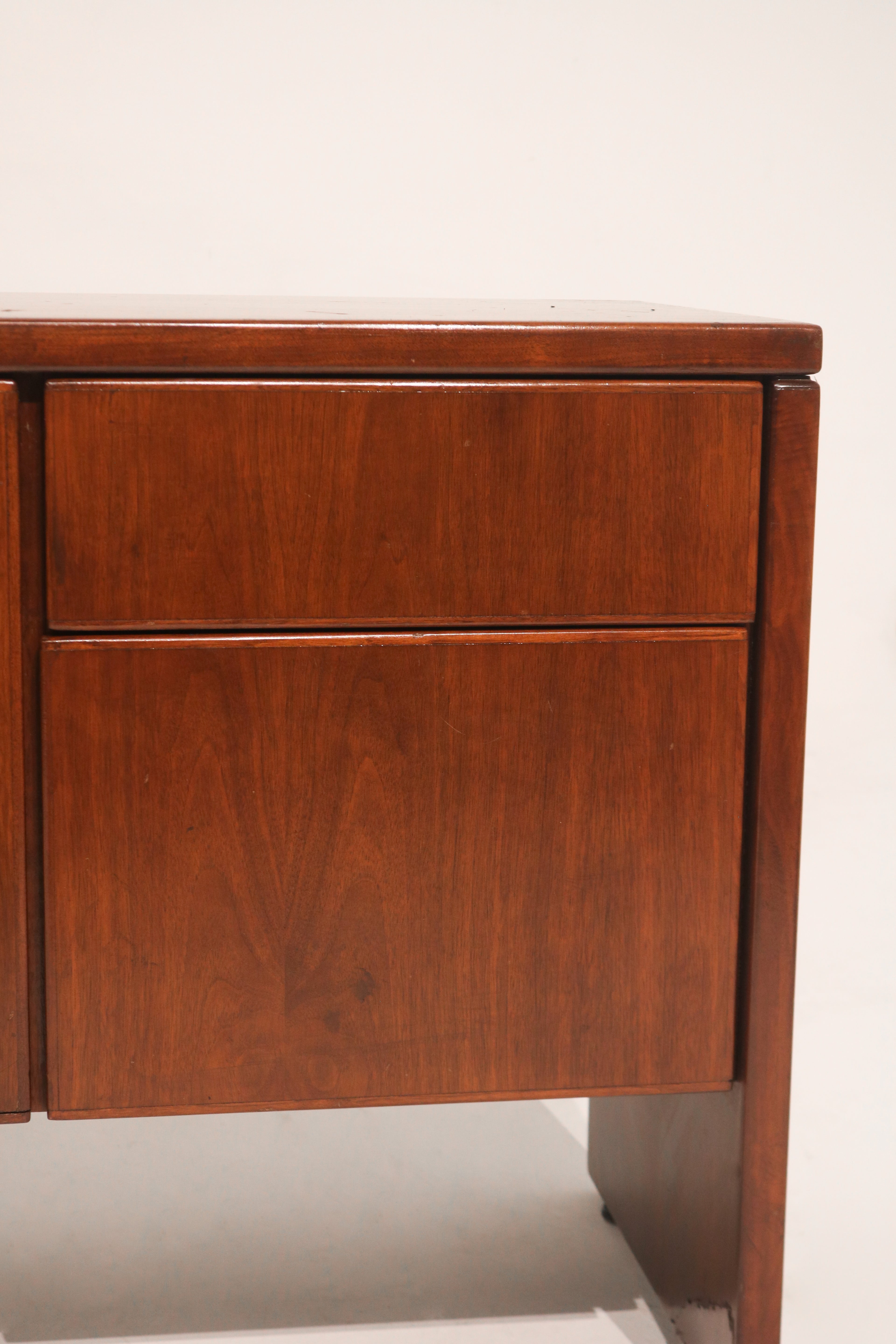 Detailed shot of left leg support showing mid-century style structure in wood