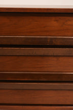 Top surface of dresser showing light scratches and wear, aged patina in walnut wood finish