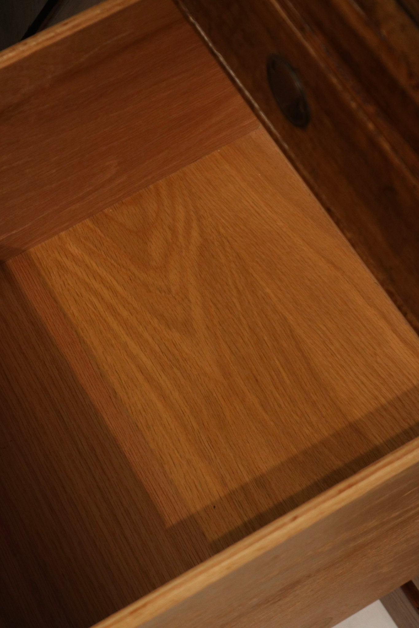 Close detail of pull mounting, screw placement and original Thomasville hardware on walnut veneer, demonstrating authentic mid-century construction. Perfect for NYC apartments.