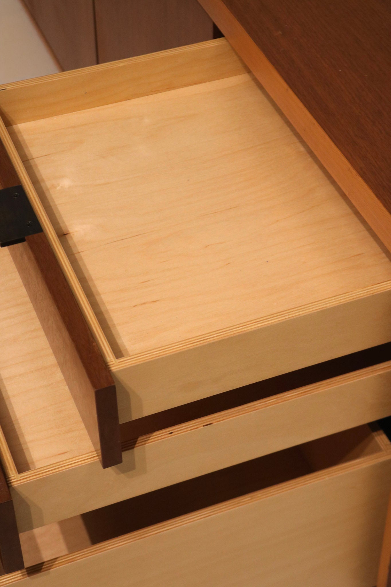 Detail capture of light reflecting off walnut surface, highlighting natural sheen
